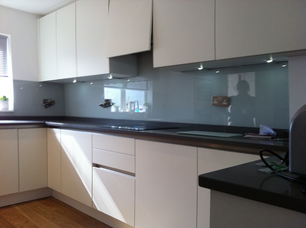 Grey glass kitchen splashback with LED lighting in Deptford