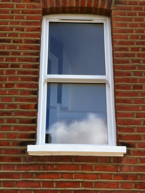 uPVC sash window on Victorian red brick house in Deptford